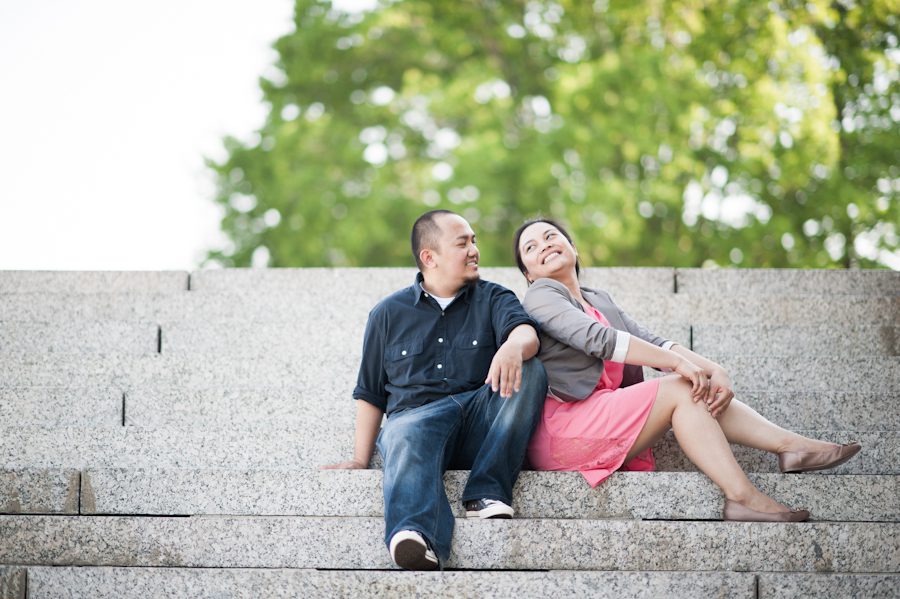 Bing and Roy share a laugh on the steps of the Capitol Lawn during their engagement session with Washington DC Wedding Photographer Ben Lau.