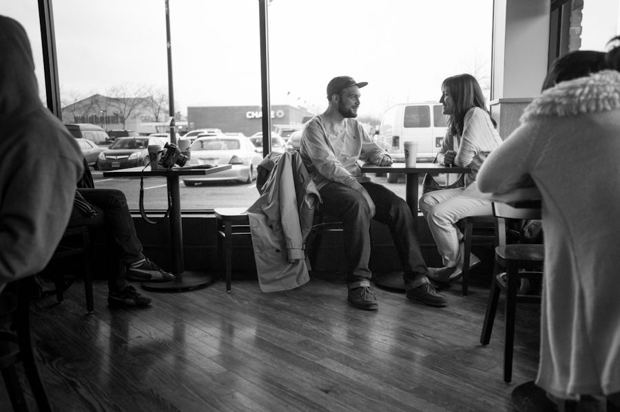 Korey and Eric sit inside a coffee shop in Long Island during their engagement session with awesome New York Wedding Photographer Ben Lau.