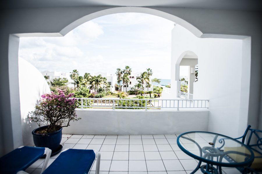 View of the patio at the CuisinArt Resort & Spa in Anguilla, BWI. Captured by Caribbean Destination Wedding photographer Ben Lau before Lauren and Justin's rehearsal dinner on the island.