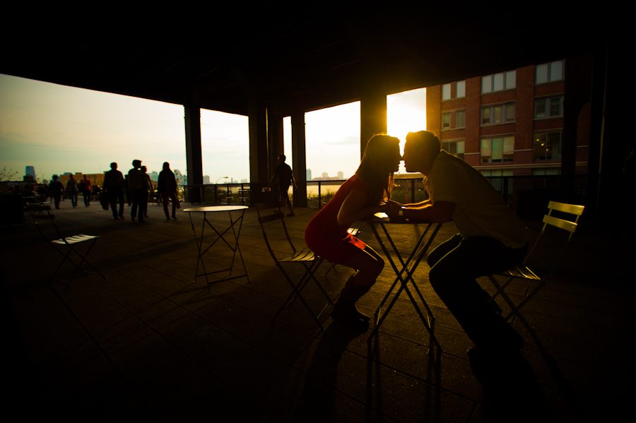 Lauren and Tony share a kiss at sunset at High Line Park during their engagement session with awesome New York City wedding photographer Ben Lau.