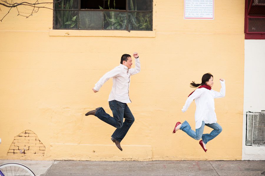 Lisa and Kai jump simultaneously during their engagement session in Williamsburg, NY with Ben Lau Photography.