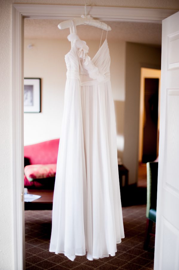 Wedding dress in the doorway. Nicole and Dave's wedding day captured by Ben Lau Photography.