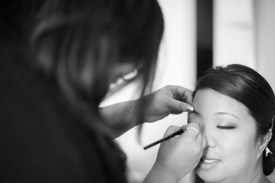 Nicole has her make-up applied on her wedding day in Washington DC. Captured by Ben Lau Photography.