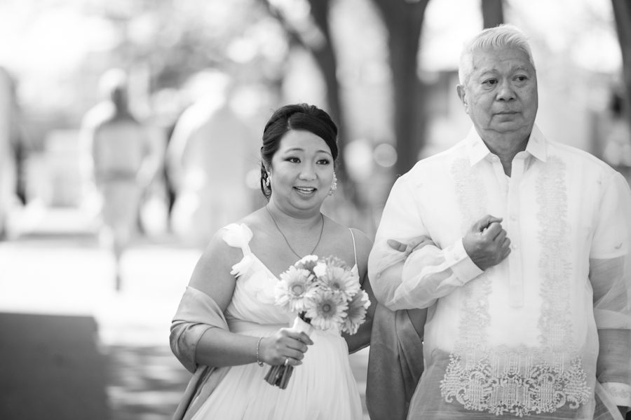 Bride and her father walk towards the wedding ceremony in Washington DC. Captured by Ben Lau Photography.