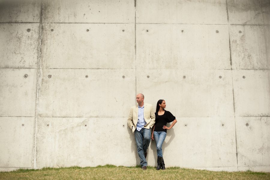 Patrice and Josh pose against a wall during their engagement in Jersey City, NJ with awesome NJ wedding photographer Ben Lau.
