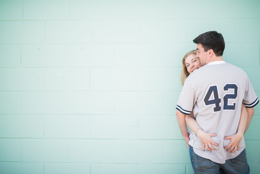 Alexis grabs Mike's butt during their engagement session on Long Beach Island with awesome NJ wedding photographer Ben Lau.