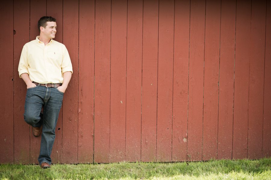Rob poses along a barn wall during his engagement session with awesome NJ wedding photographer Ben Lau.