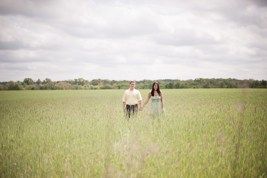 Kelly and Rob pose in a vast field of tall grass during their engagement session in NJ Wine Country with awesome Central NJ Wedding Photographer Ben Lau.