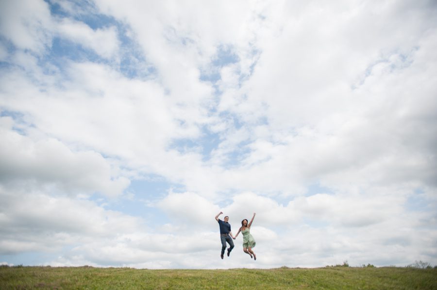 Rob and Kelly jump in the air for their engagement session in Central NJ. Captured by awesome NJ wedding photographer Ben Lau.