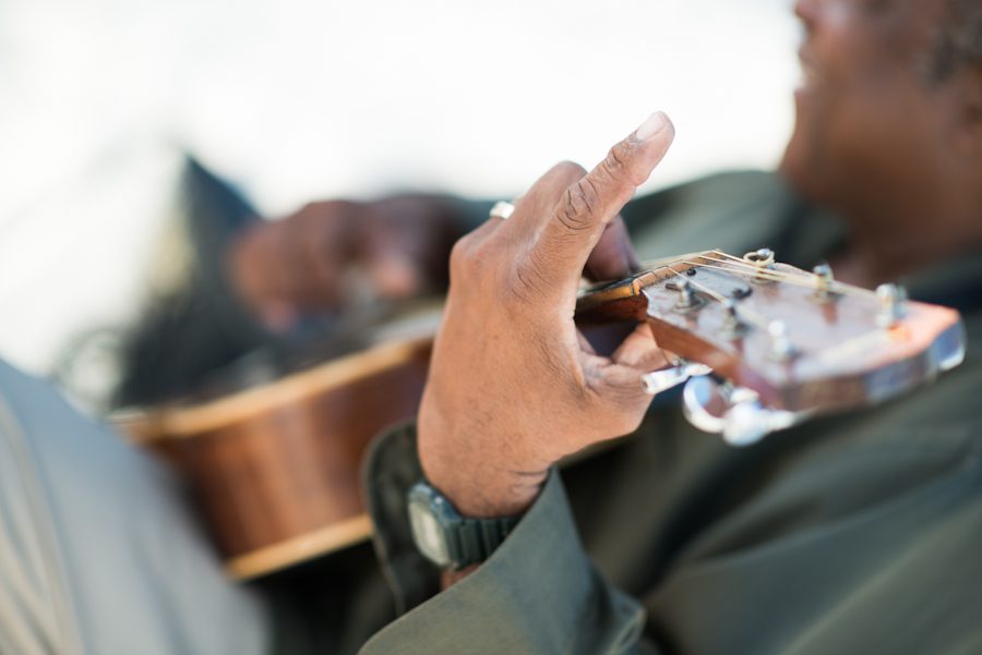 Guitarist playing for wedding ceremony at the CuisinArt Resort & Spa in Anguilla. Captured by Caribbean destination wedding photographer Ben Lau.