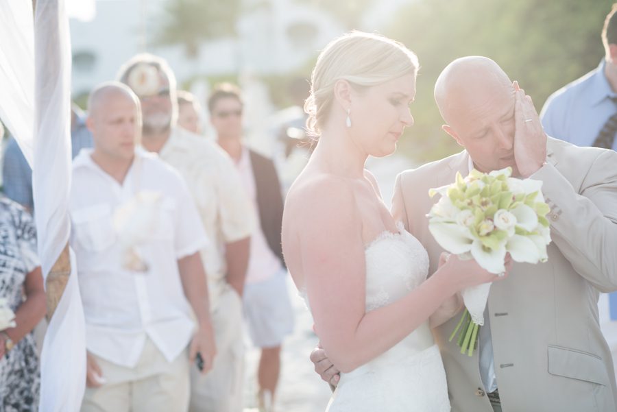Bride and groom exchange vows during their wedding ceremony at the CuisinArt Resort & Spa in Anguilla. Captured by Caribbean destination wedding photographer Ben Lau.