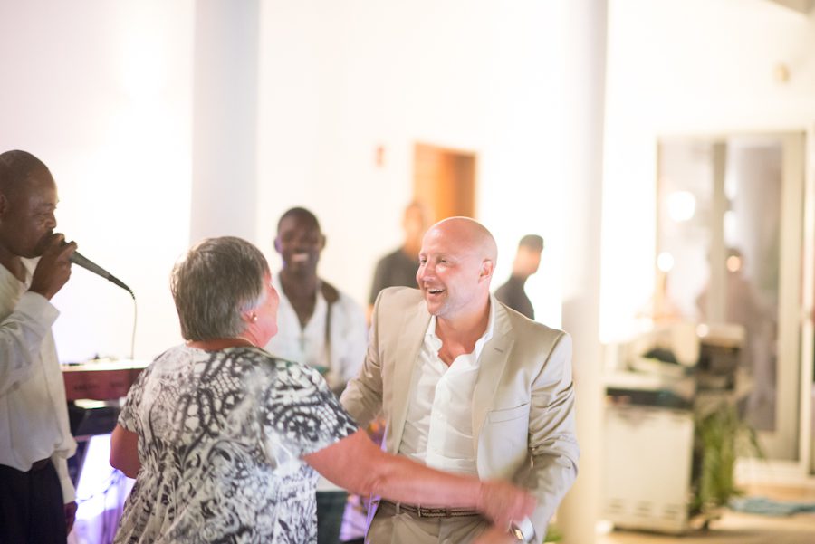 Groom dances with his mom during his reception at the CuisinArt Resort & Spa in Anguilla. Captured by Caribbean destination wedding photographer Ben Lau.