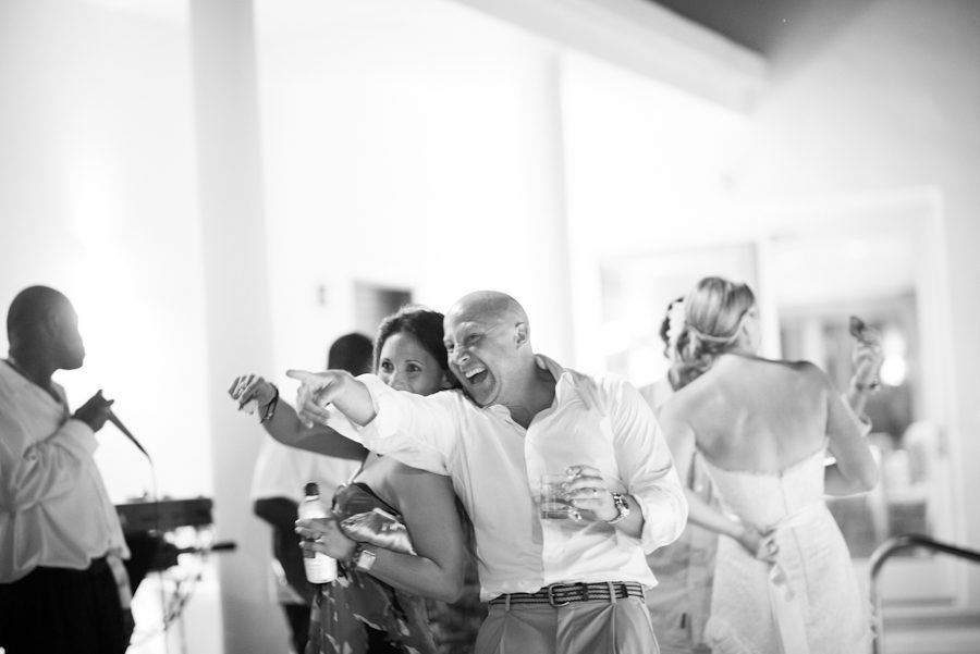 Justin dances during the reception of his wedding at the CuisinArt Resort & Spa in Anguilla. Captured by Caribbean destination wedding photographer Ben Lau.