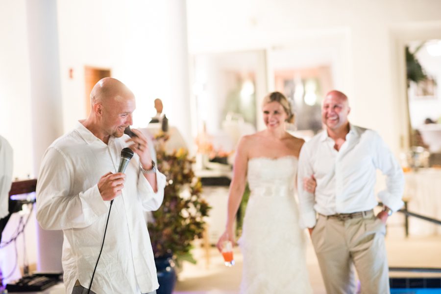 Brother of groom makes a speech during a wedding at the CuisinArt Resort Spa in Anguilla. Captured by Caribbean destination wedding photographer Ben Lau.