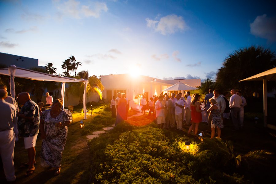 Sun sets over reception for Lauren and Justin's wedding at the CuisinArt Resort & Spa in Anguilla. Captured by Caribbean destination wedding photographer Ben Lau.
