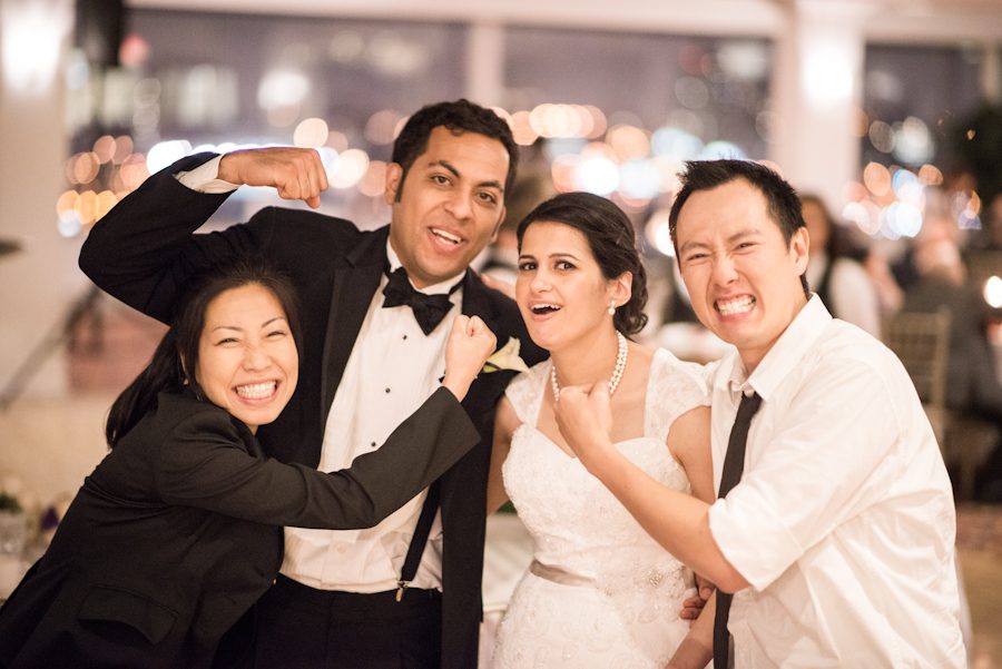 Ben and Karis get together during with the bride and groom during a wedding reception at the Palisadium in Cliffside Park, NJ. Captured by awesome NJ wedding photographer Ben Lau.