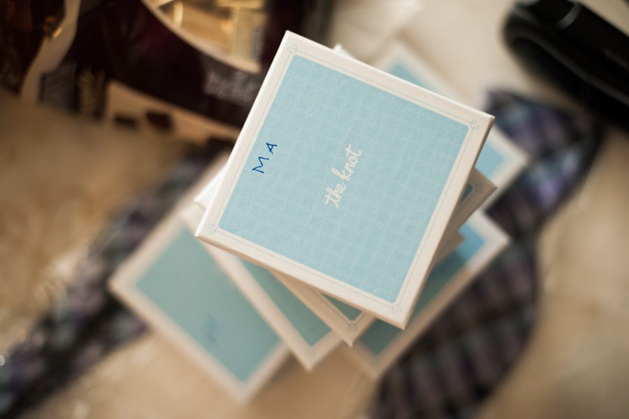 Boxes of bow ties from TheKnot at the grooms house. Captured by awesome NJ wedding photographer Ben Lau.