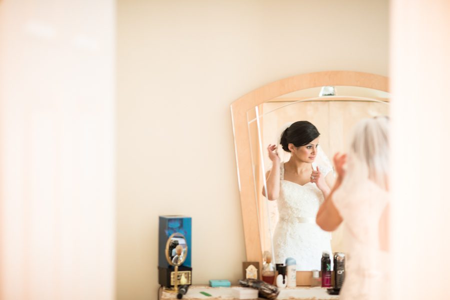 Bride Magi gets ready at her home in Little Falls for her wedding day in Jersey City, NJ. Captured by awesome New Jersey wedding photographer Ben Lau.