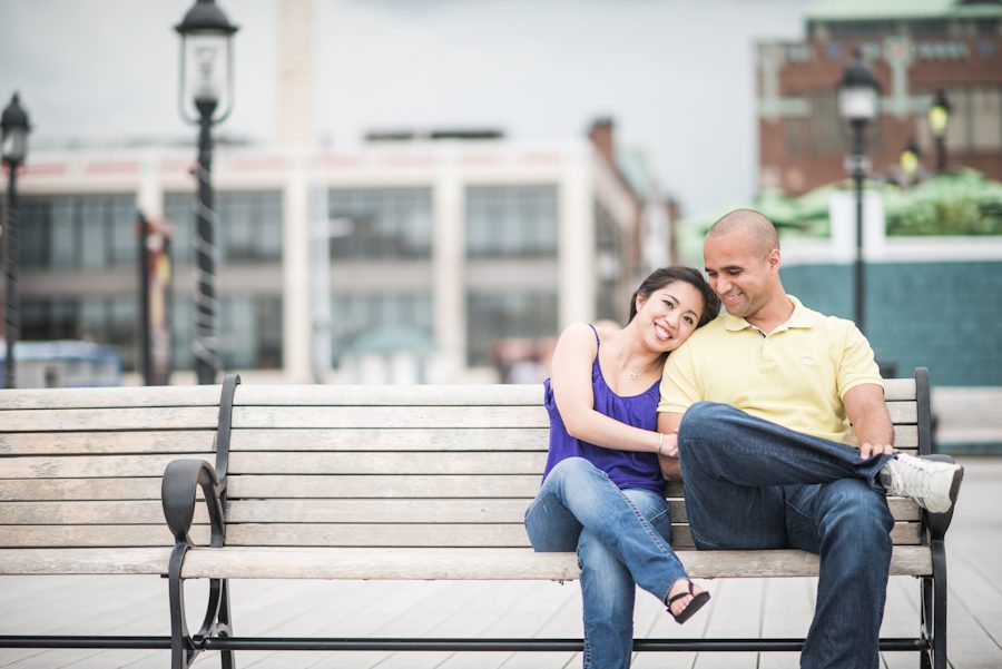 Maricar and Izaak sit on a bench during their engagement session with Northern Virginia wedding photographer Ben Lau.