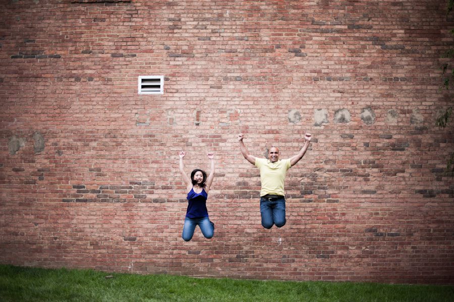 Maricar and Izaak do a jumping pose during their engagement session with Northern Virginia wedding photographer Ben Lau.