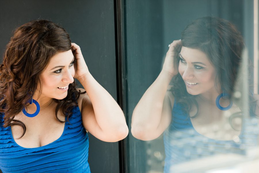 Nicole poses by a window during their engagement session in the Meatpacking District with awesome NJ wedding photographer Ben Lau.
