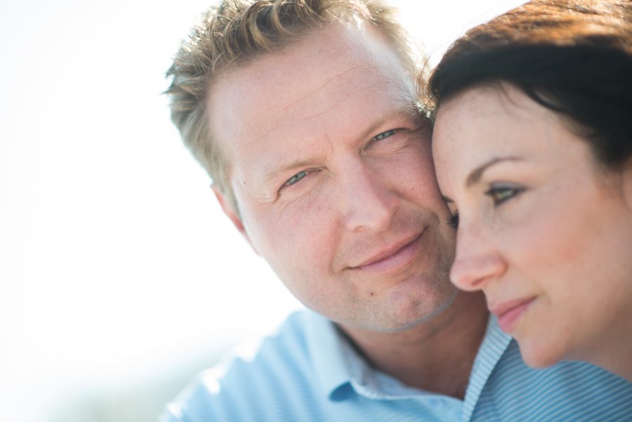Gregg looks into the camera on Long Beach Island, NJ during their engagement session with Ben Lau Photography.