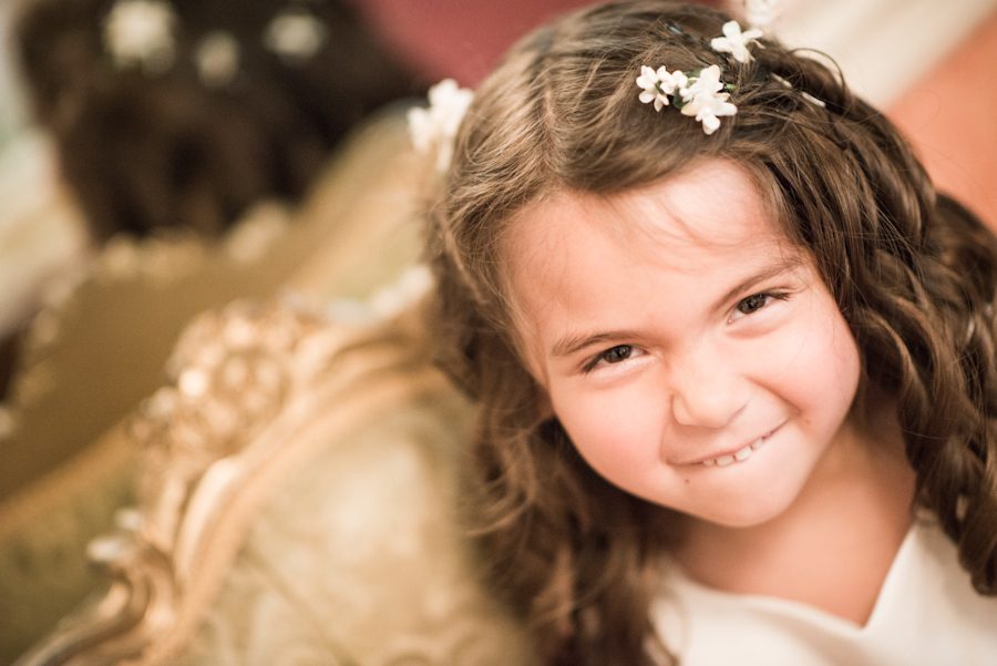 Flower girl makes a face on Patrice and Josh's wedding day at The Manor in West Orange. Captured by best NJ wedding photographer Ben Lau.