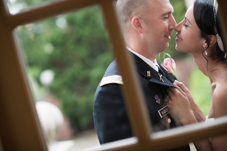 Bride and groom share a kiss on their wedding day at The Manor in West Orange, NJ. Captured by awesome NJ wedding photographer Ben Lau.