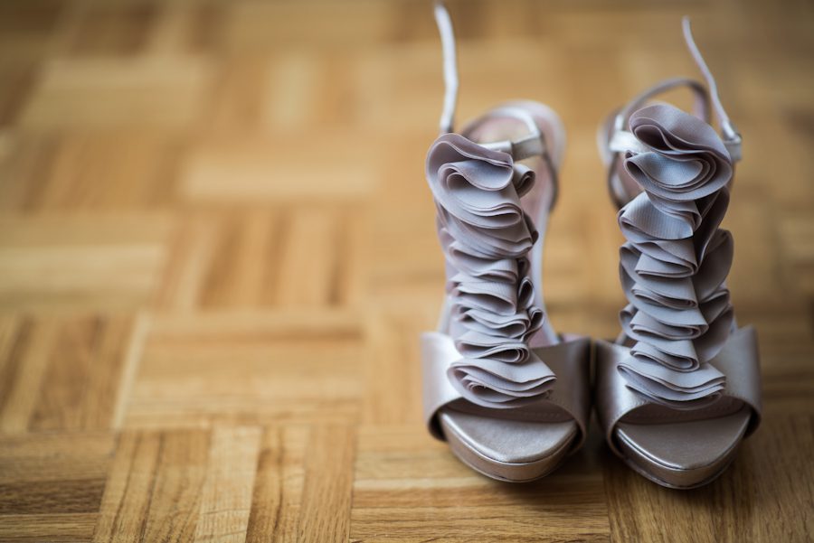 Bride's shoes on her wedding day in Montreal, QC. Captured by destination wedding photographer Ben Lau.