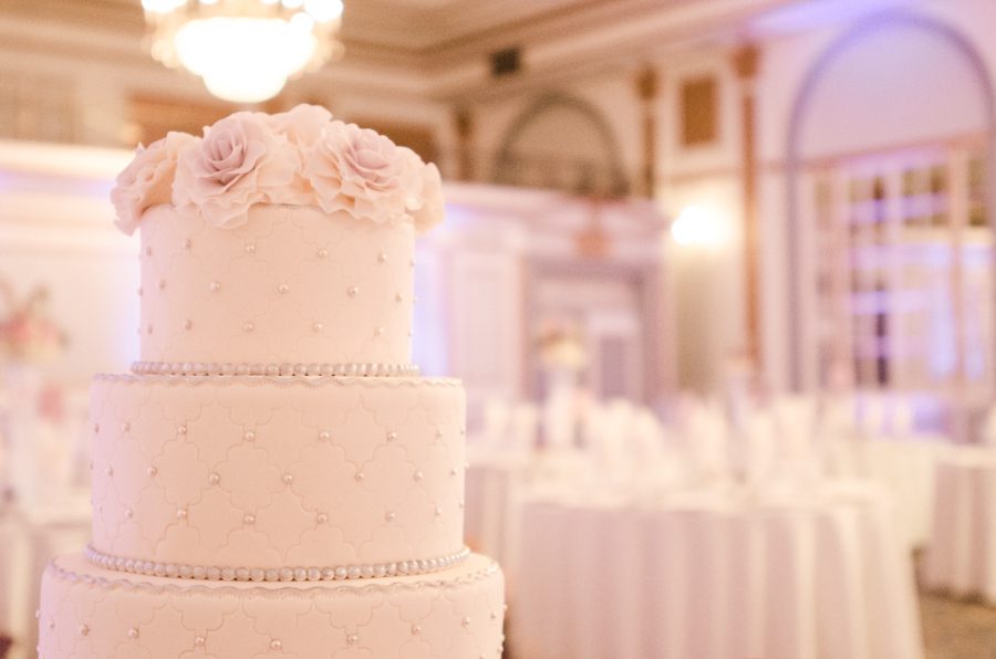 Wedding cake at Le Windsor in Montreal, QC. Captured by destination wedding photographer Ben Lau.