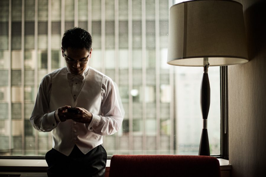 Groom gets ready on his wedding day. Captured by Montreal, QC wedding photographer Ben Lau.