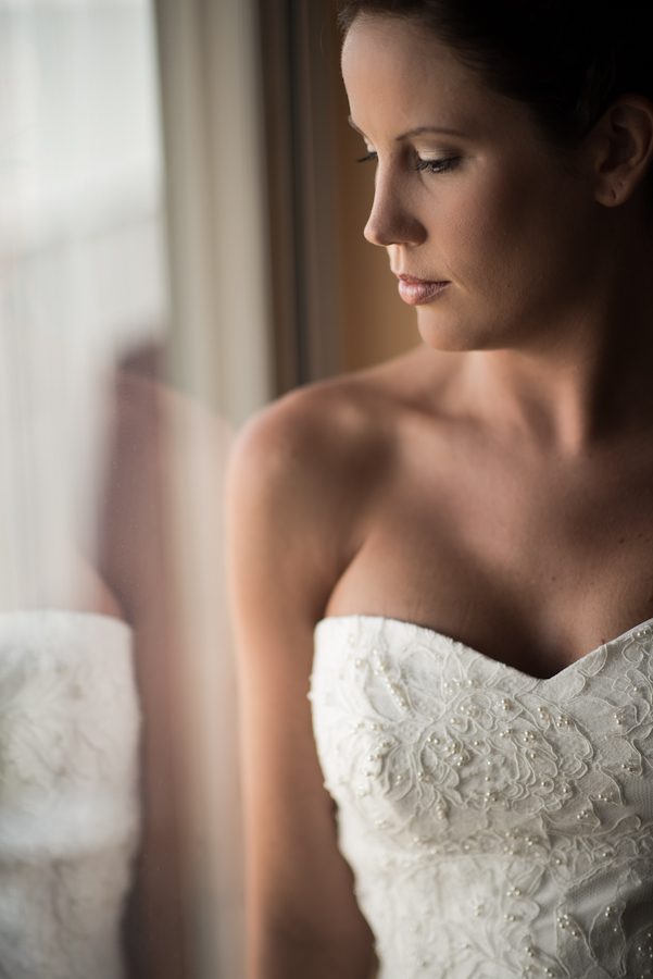 Bride poses for her portraits before her ceremony at Herrington on the Bay in Chesapeake Beach, MD. Captured by NJ wedding photographer Ben Lau.
