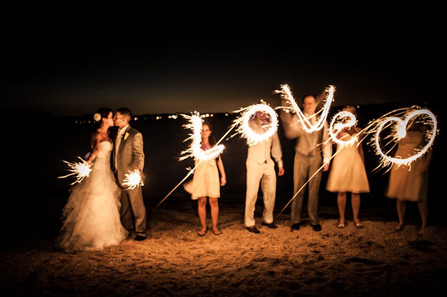 Sparklers spell words during a wedding at Herrington on the Bay in Chesapeake Beach, MD. Captured by awesome NJ wedding photographer Ben Lau.