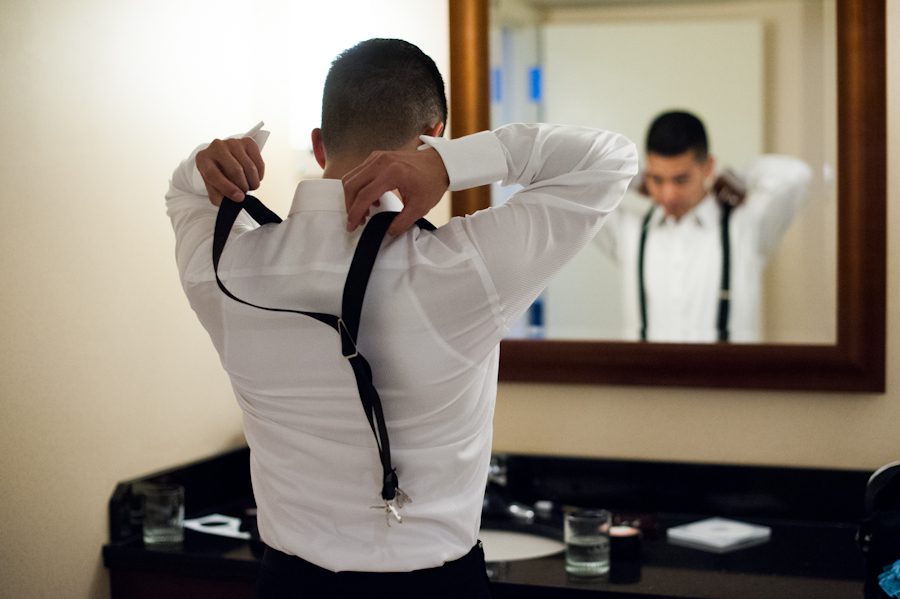 Groom gets ready on his wedding day at M&T Bank Raven Stadium in Baltimore, MD. Captured by awesome NJ wedding photographer Ben Lau.