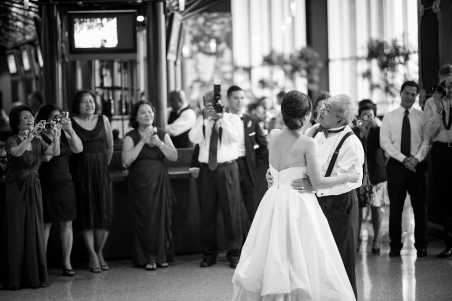 Father and daughter dance during wedding at Ravens Stadium in Baltimore, MD. Captured by awesome Ben Lau Photography.