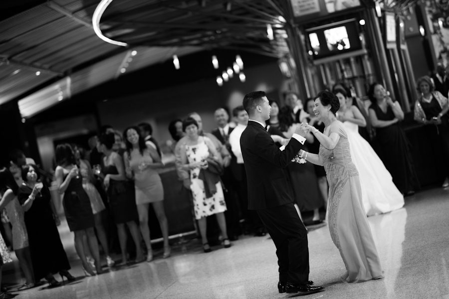 Mother and son dance during wedding at Ravens Stadium in Baltimore, MD. Captured by awesome Ben Lau Photography.