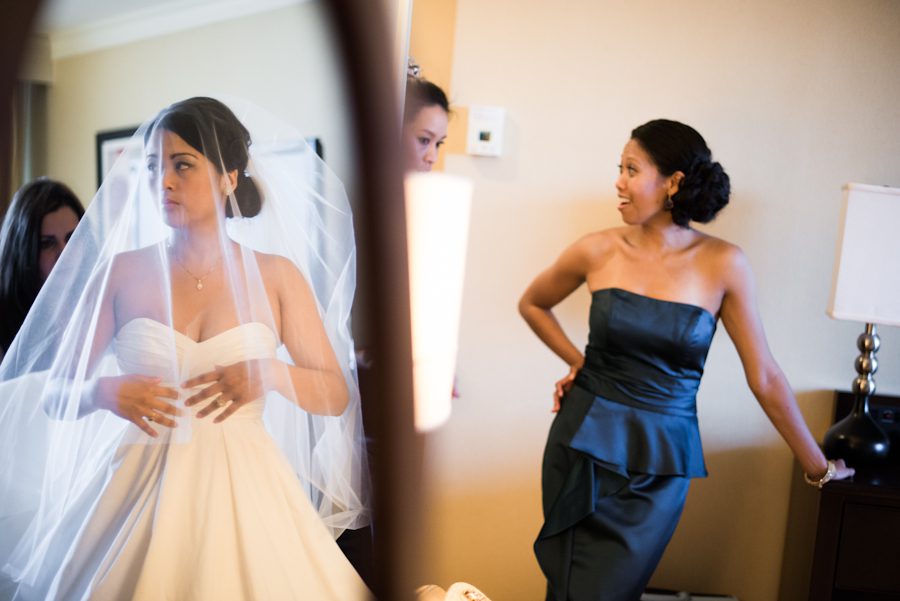 Bride gets ready for her wedding day at the Marriott in Baltimore, MD. Captured by awesome Ben Lau Photography.