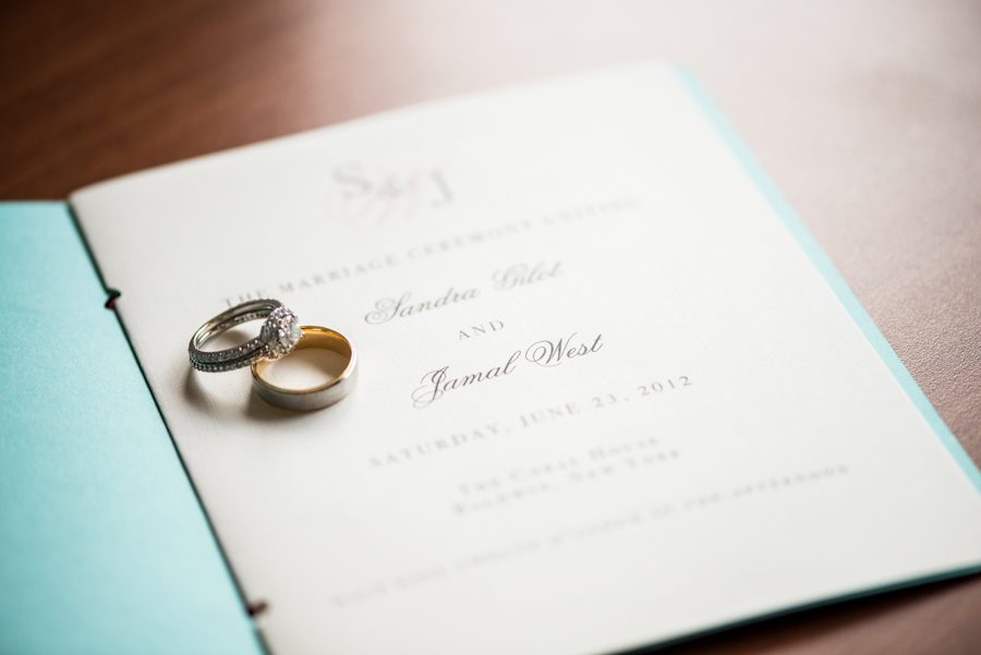Rings and wedding program for Sandra and Jamal's wedding at the Coral House in Baldwin, NY. Captured by awesome NJ wedding photographer Ben Lau.