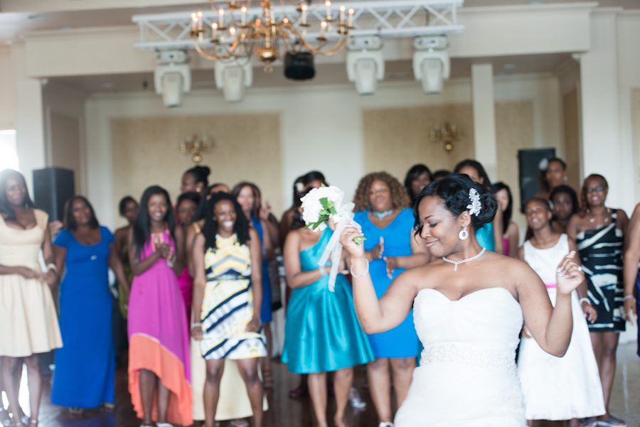 Bride dances during her wedding at the Coral House in Baldwin, NY. Captured by awesome NJ wedding photographer Ben Lau.