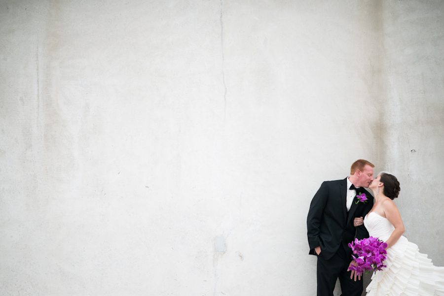 Bride and Groom pose against a wall during their bridal portraits in New Brunswick, NJ. Captured by best NJ wedding photographer, Ben Lau.