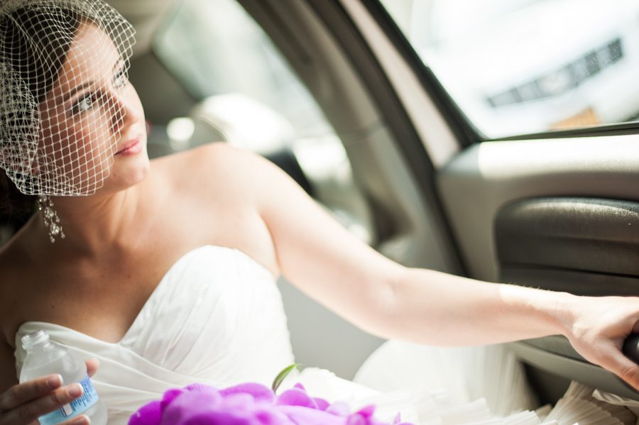 Bride sits in the limo on her way to her wedding ceremony in New Brunswick, NJ. Captured by best NJ wedding photographer, Ben Lau.