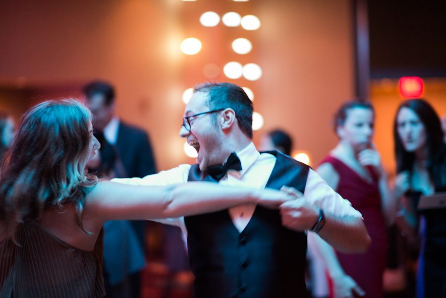 Guests dance at Tessa and Dave's wedding reception at the Heldrich Hotel in New Brunswick, NJ. Captured by awesome northern NJ wedding photographer Ben Lau.