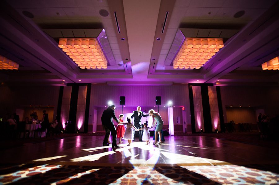 Guests dance during Tessa and Dave's wedding reception at the Heldrich Hotel in New Brunswick, NJ. Captured by awesome northern NJ wedding photographer Ben Lau.
