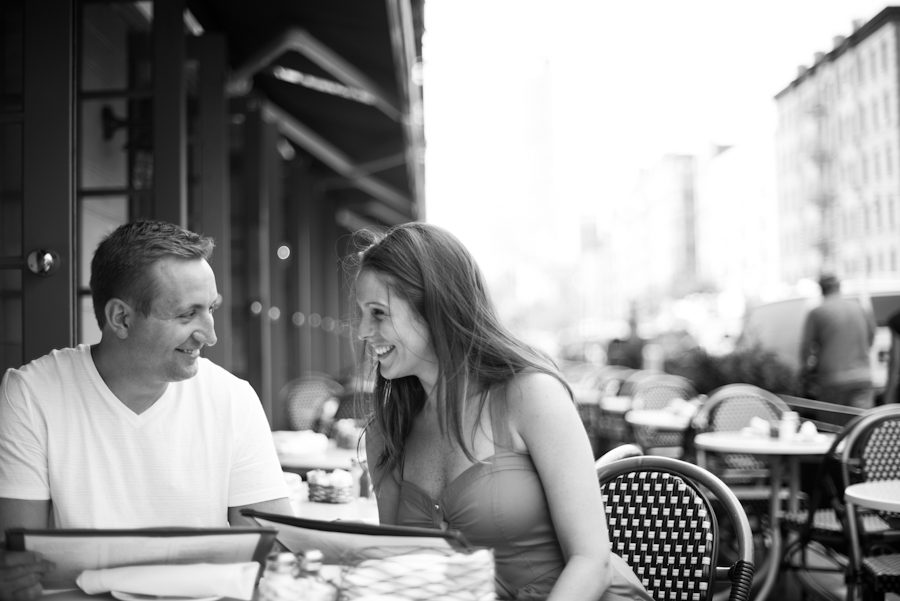 Kathleen and Tim take a break during their engagement session in New York City. Captured by Ben Lau Photography.