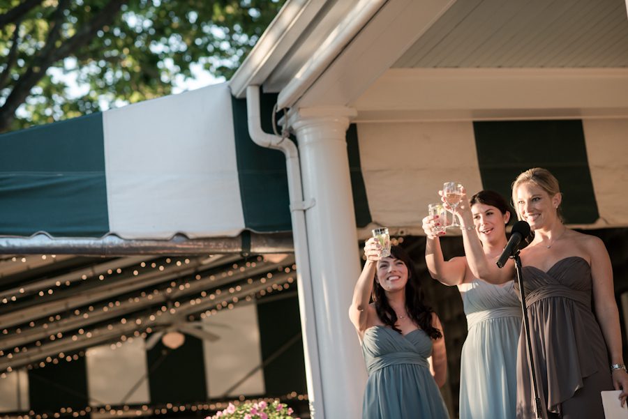 Bridesmaids make a speech on Katie and Jason's wedding day on Shelter Island, NY. Captured by Northern NJ wedding photographer Ben Lau.