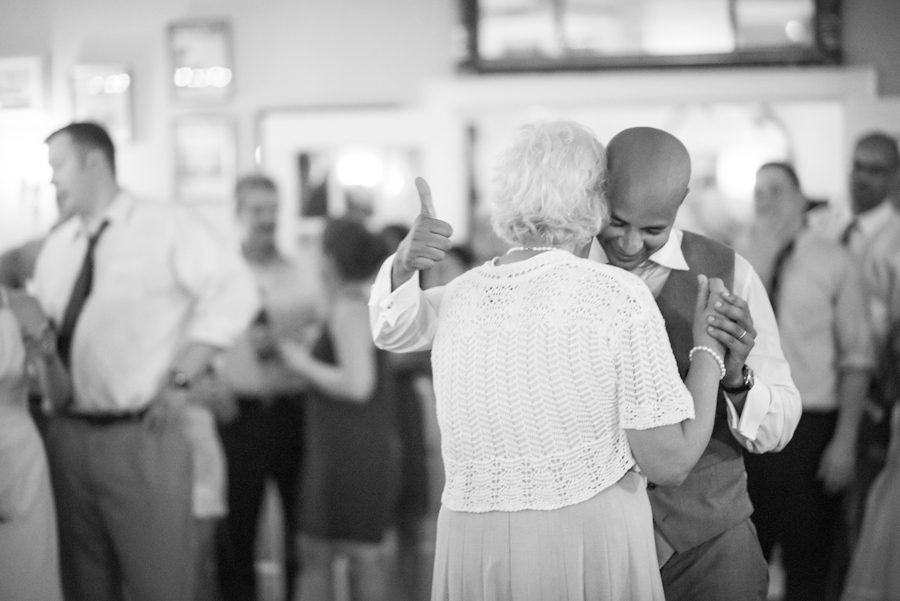 Mother and son dance on Katie and Jason's wedding day on Shelter Island, NY. Captured by Northern NJ wedding photographer Ben Lau.
