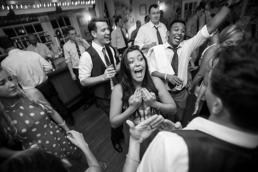 Guests dance during Katie and Jason's wedding reception at Ram's Head Inn on Shelter Island, NY. Captured by Northern NJ wedding photographer Ben Lau.