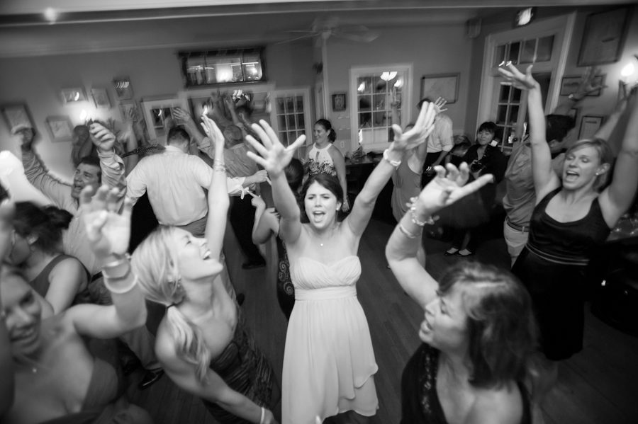 Guests dance during Katie and Jason's wedding reception at Ram's Head Inn on Shelter Island, NY. Captured by Northern NJ wedding photographer Ben Lau.