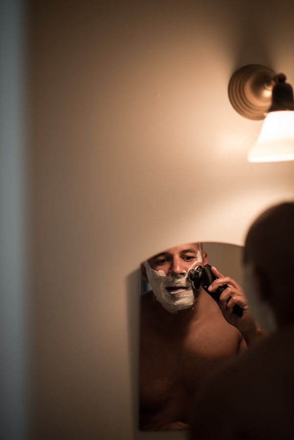 Groom preps for his wedding day at the Ram's Head Inn on Shelter Island, NY. Captured by Northern NJ wedding photographer Ben Lau.