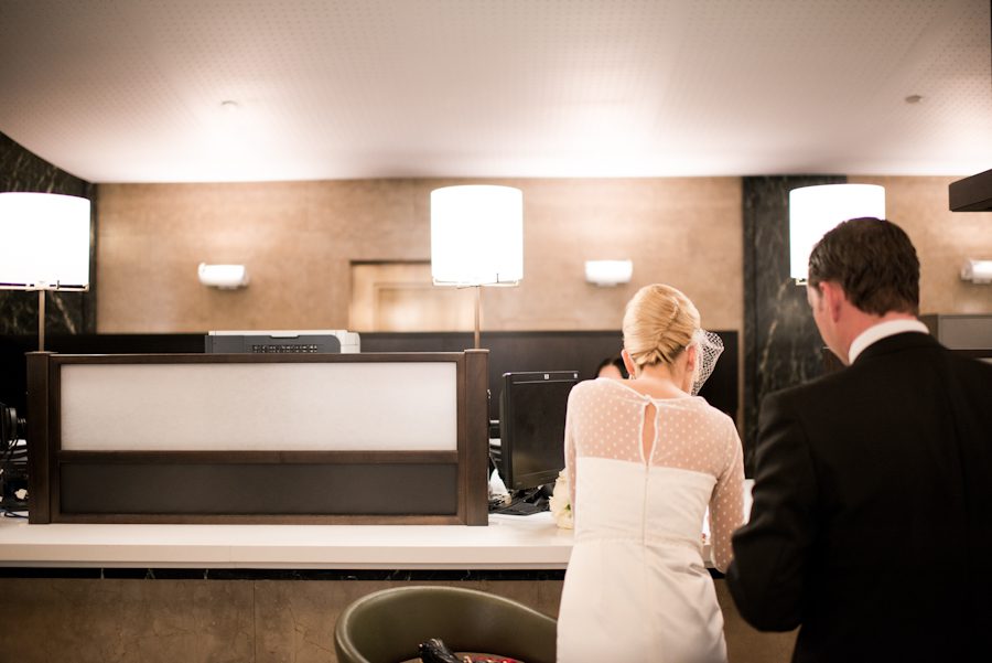 Bride and groom prepare their documents before their New York City Hall wedding. Captured by northern NJ wedding photographer Ben Lau.